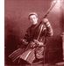 The same sitting, cropped to the head and the instrument